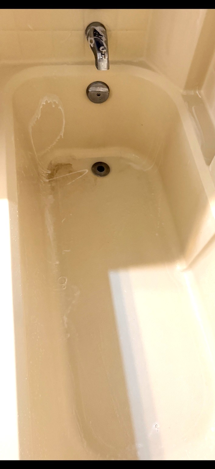 Before cleaning: bathtub and drain